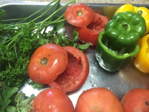 Cut the tops off tomatoes and peppers